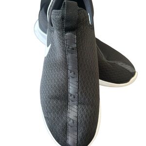 Nike Black and White Slip-On Sneakers with Streamlined Design - worn once